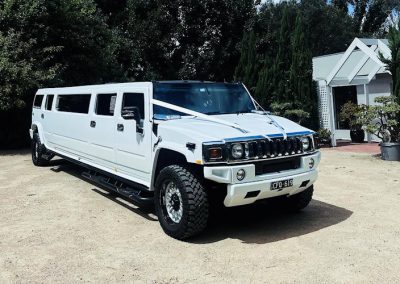 2006 White Hummer - Full side view of car