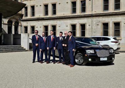 2007 Black Chrysler Limo - Formal Groom Wedding Next to car