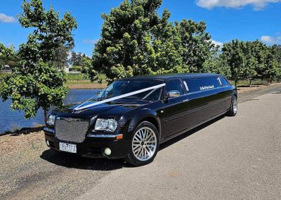 2007 Black Chrysler Limo - Side View of Car By Water